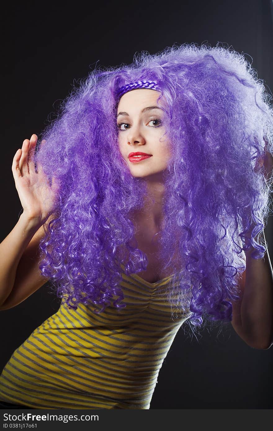 Beautiful young girl with bright violet hair. Beautiful young girl with bright violet hair