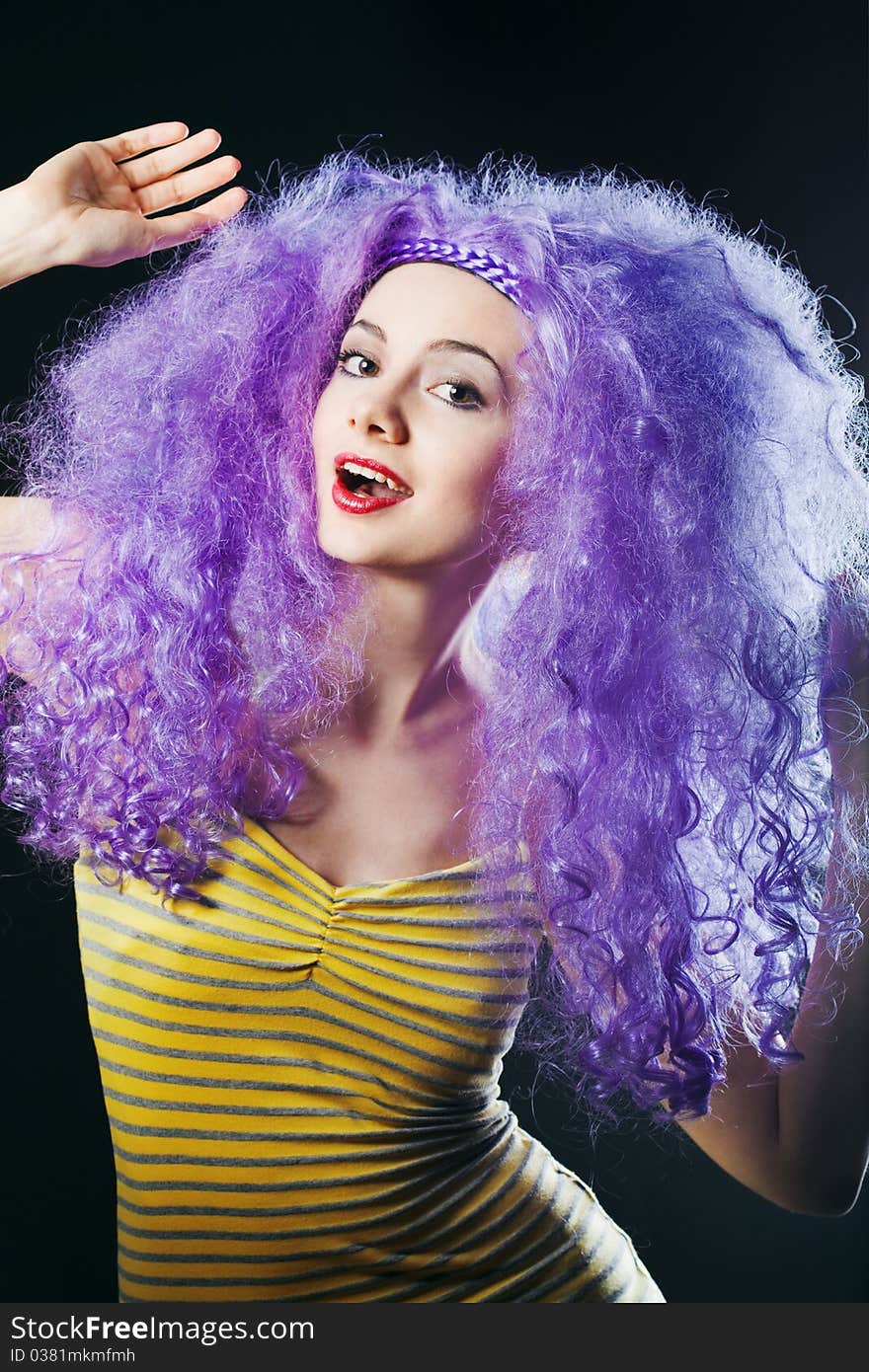 Beautiful young girl with bright violet hair. Beautiful young girl with bright violet hair