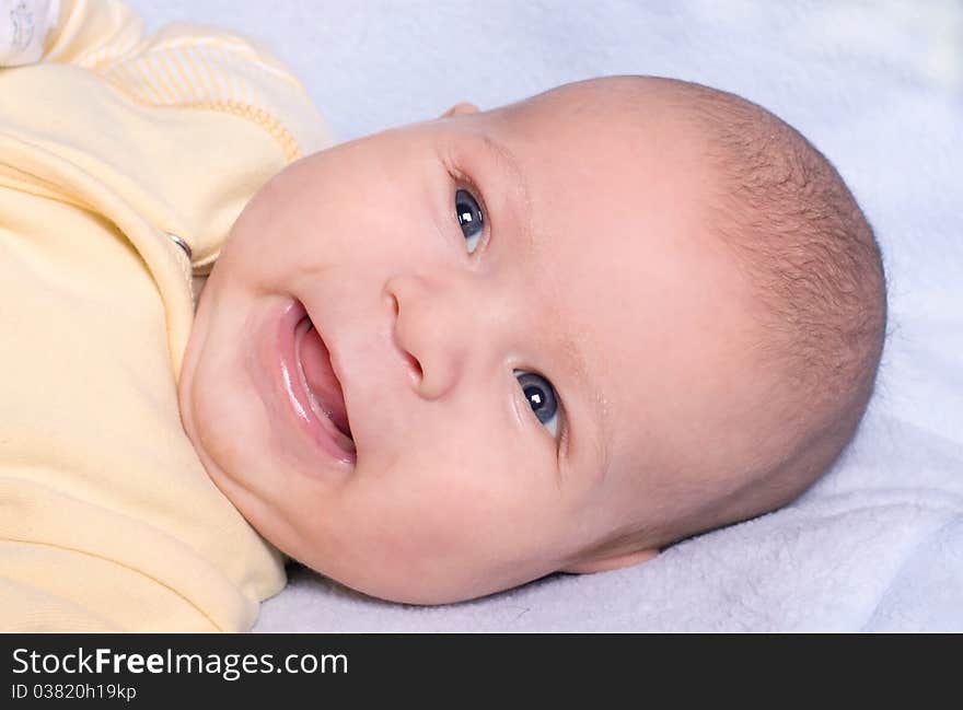 Photo of Portrait of cute newborn laughing. Photo of Portrait of cute newborn laughing