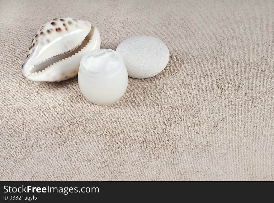 Cream shell and stone on the towel