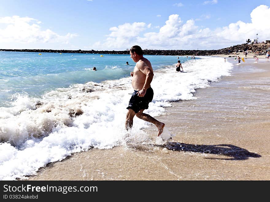 Man running at the beach