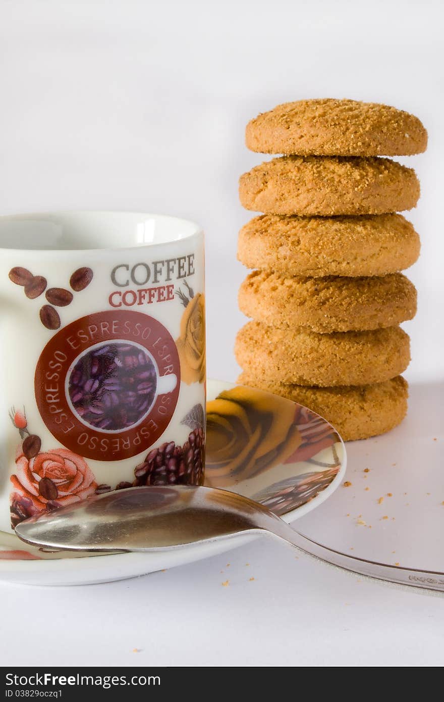 Coffee cup and biscuit