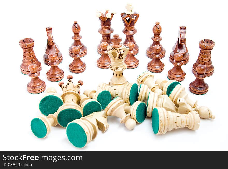 Defeat - last one standing, chess figures on white background