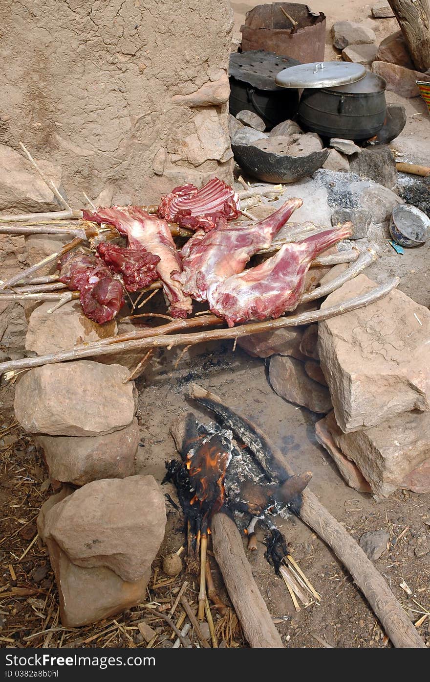 Goat Cooking Over A Fire In A Dogon Village