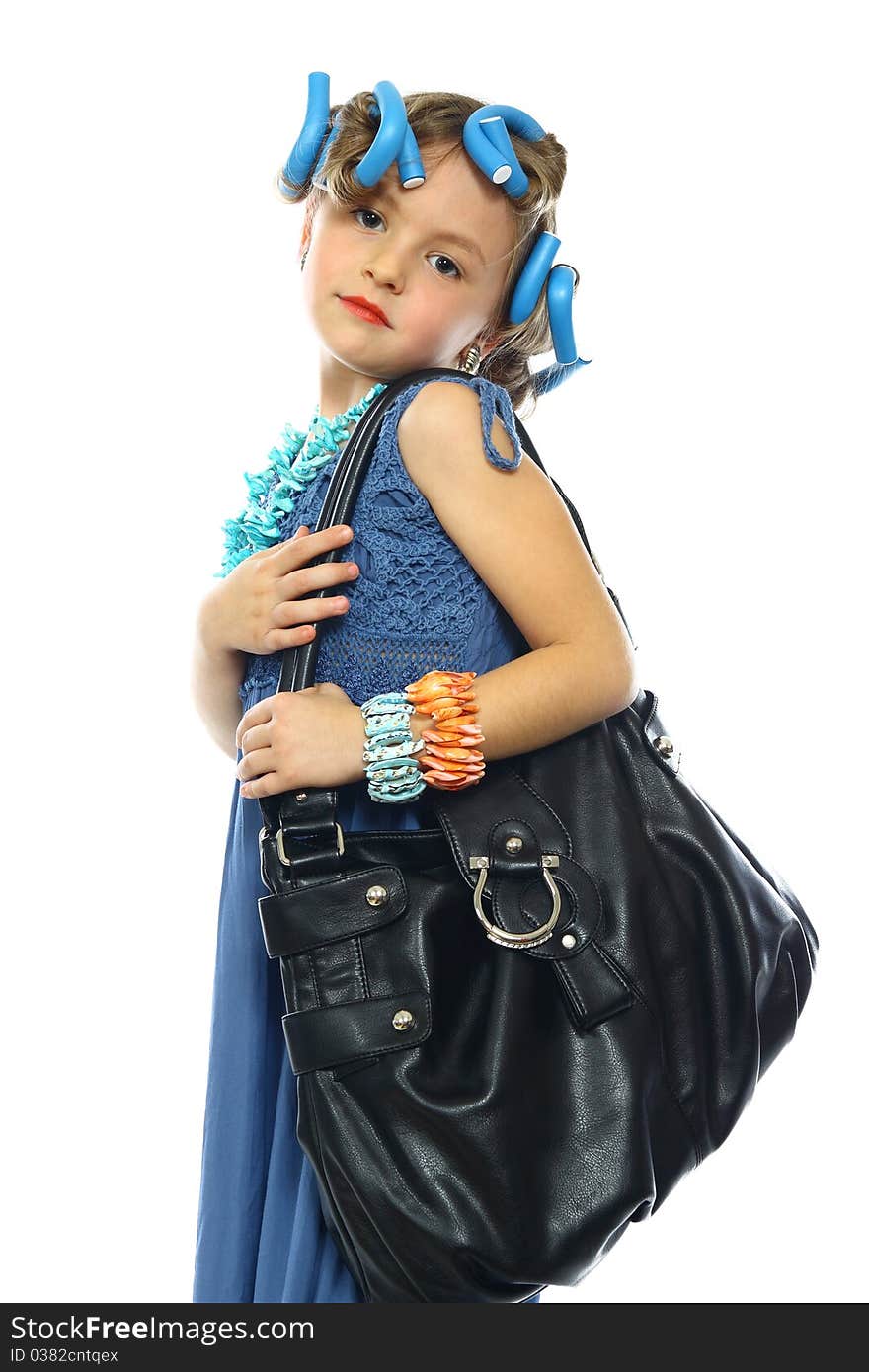 Cute little girl posing in a nice dress and handbag. Cute little girl posing in a nice dress and handbag