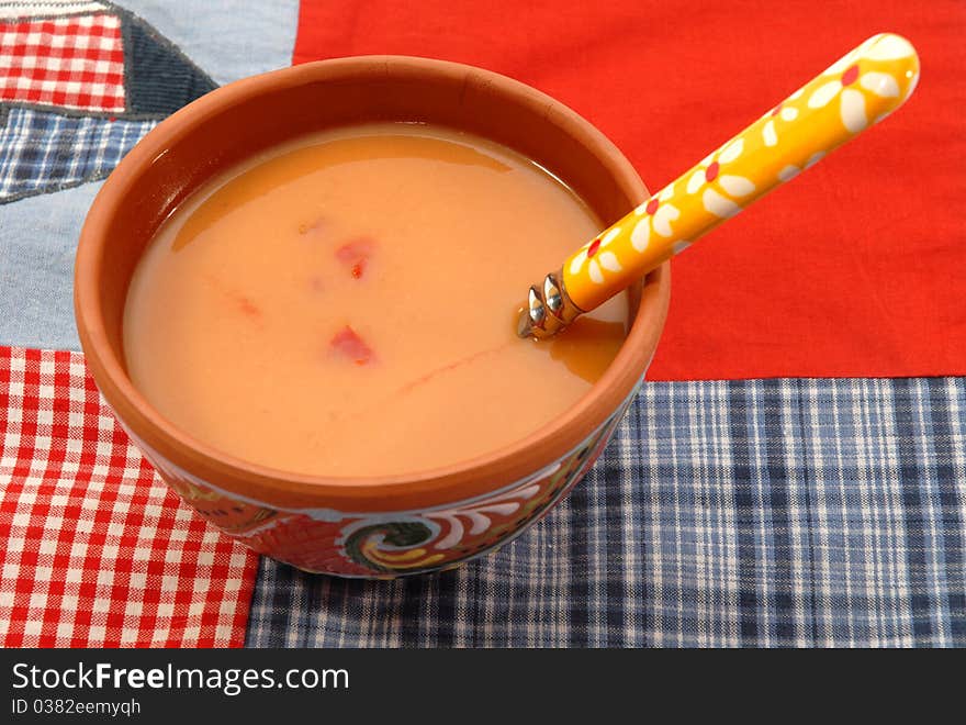 Bowl of tomato soup on table tablecloth