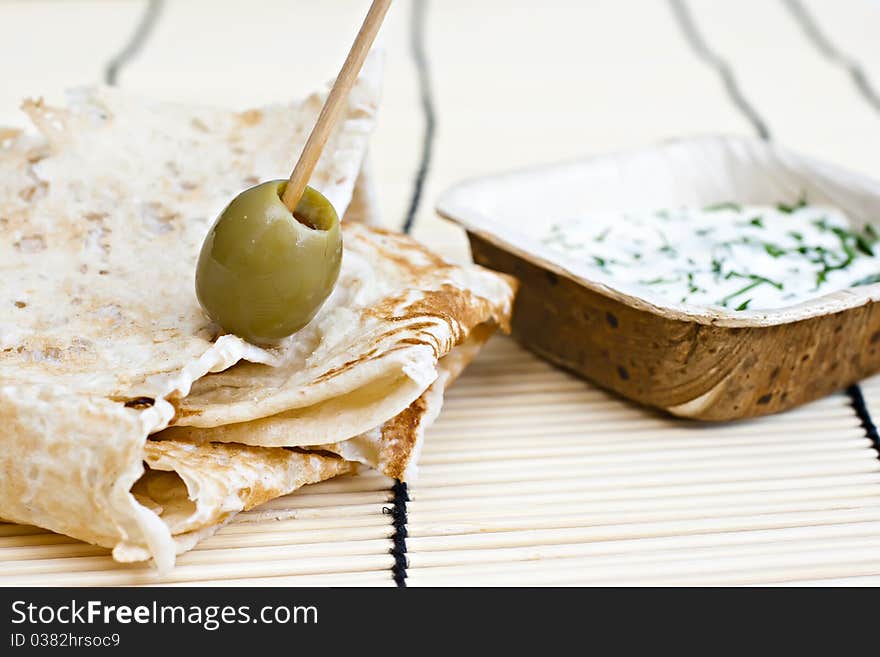 Wheat bread with olive and dip. Wheat bread with olive and dip.