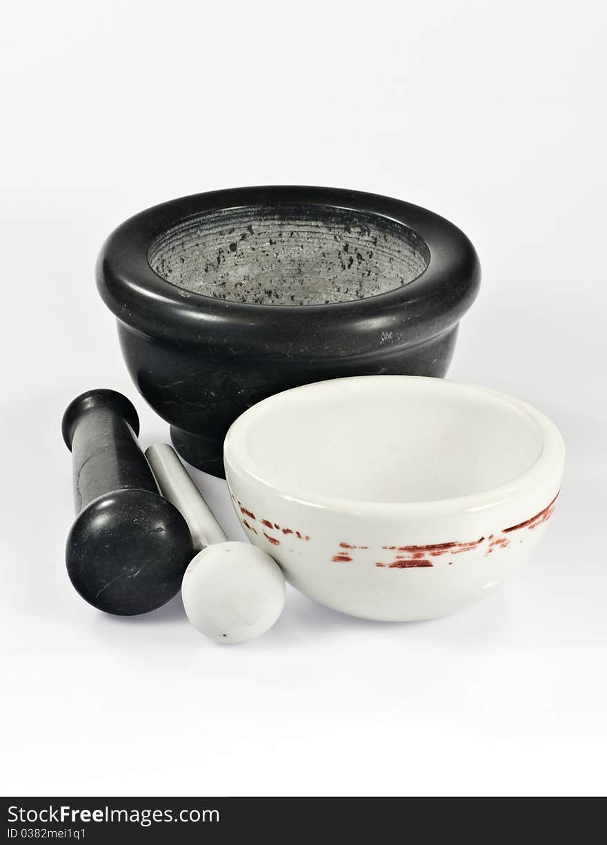 Two mortars with pestles on white background