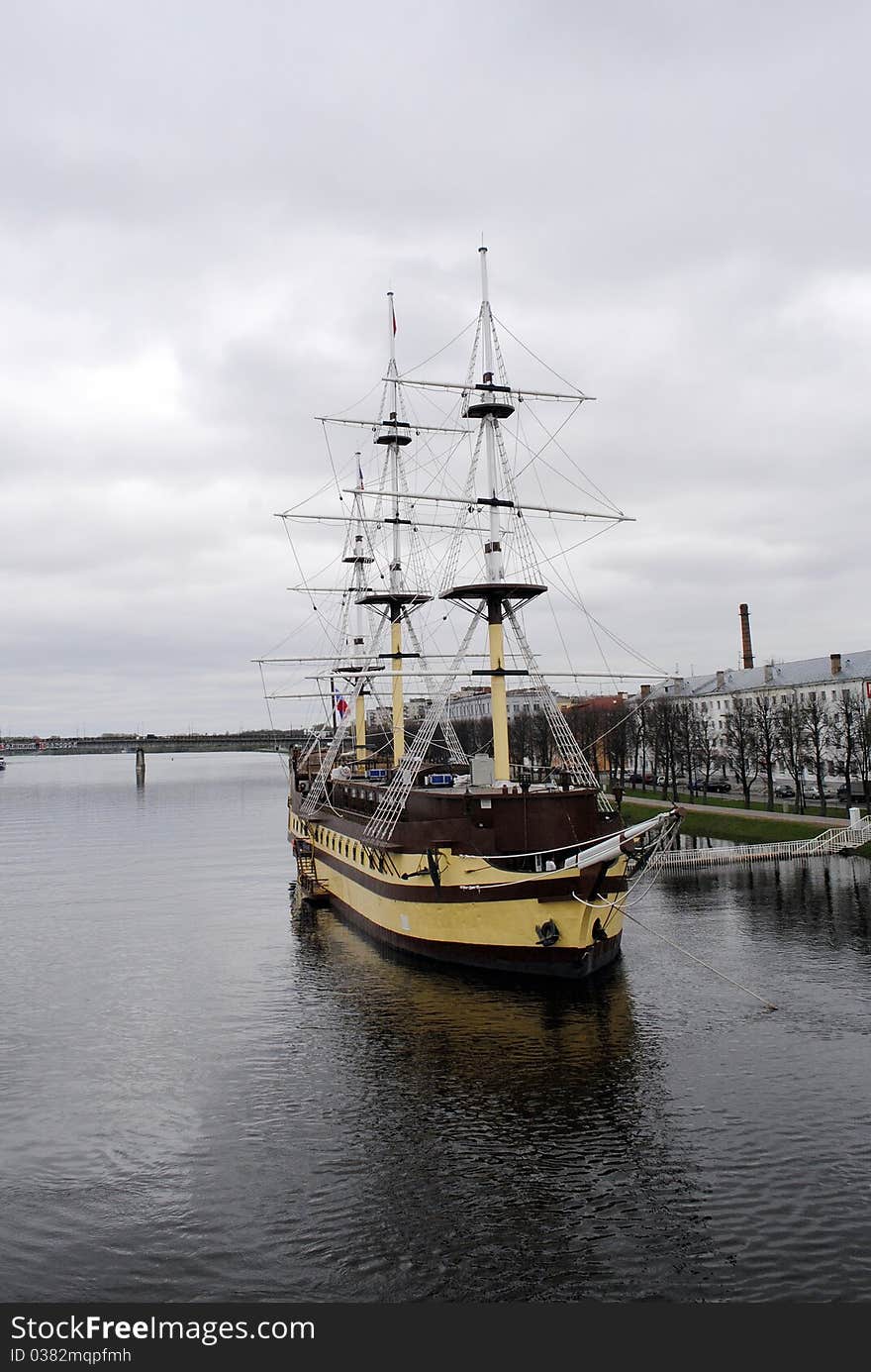 A sailing ship on the Volkhov river. Gloomy weather.  Velikij Novgorod , Russia. A sailing ship on the Volkhov river. Gloomy weather.  Velikij Novgorod , Russia.