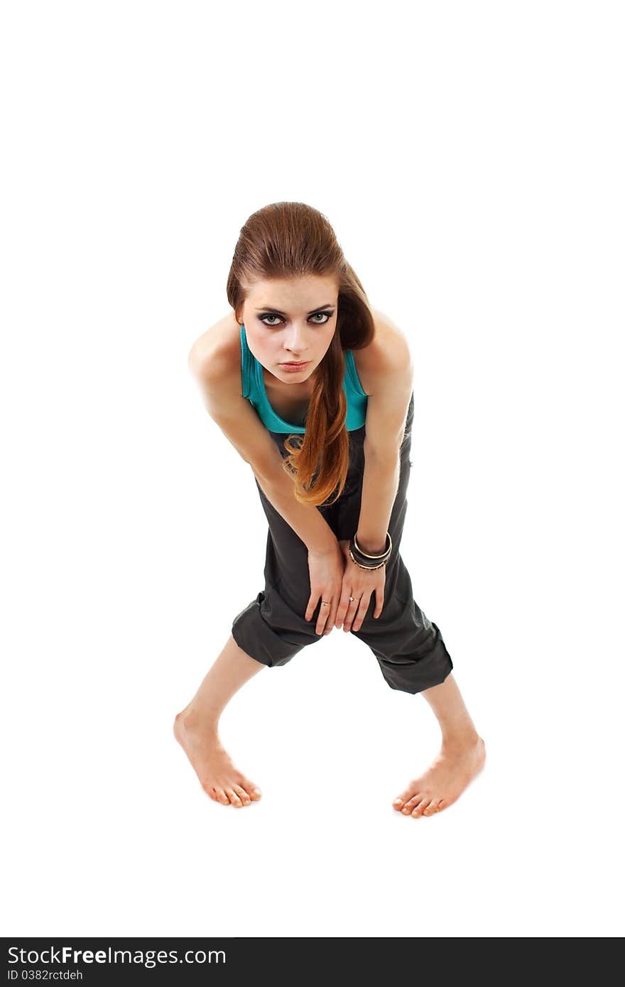 Girl in a dark makeup in blue T-shirt on white background