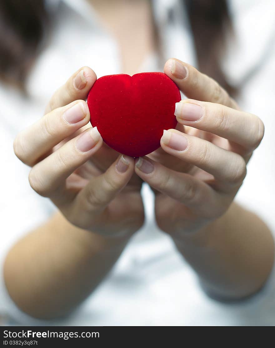 Red engagement box holding by hand of young girl