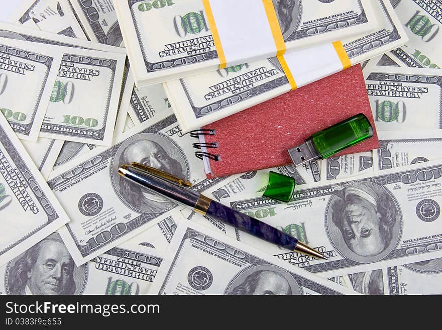 Dollars, notebook and pen, money background