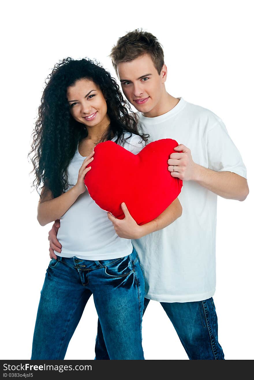 Young couple with a heart over white background