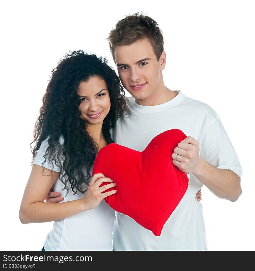 Young couple with a heart over white background