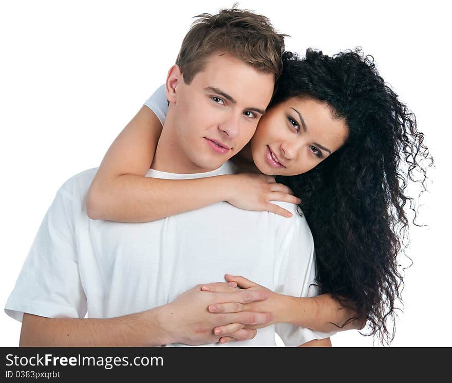 Young couple with a heart over white background