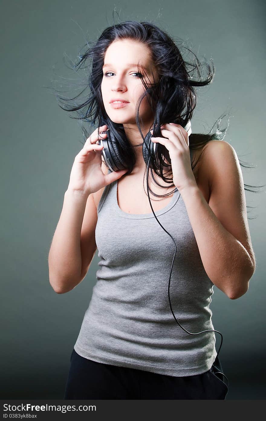 To enjoy music, girl dance with a ear-phones. To enjoy music, girl dance with a ear-phones