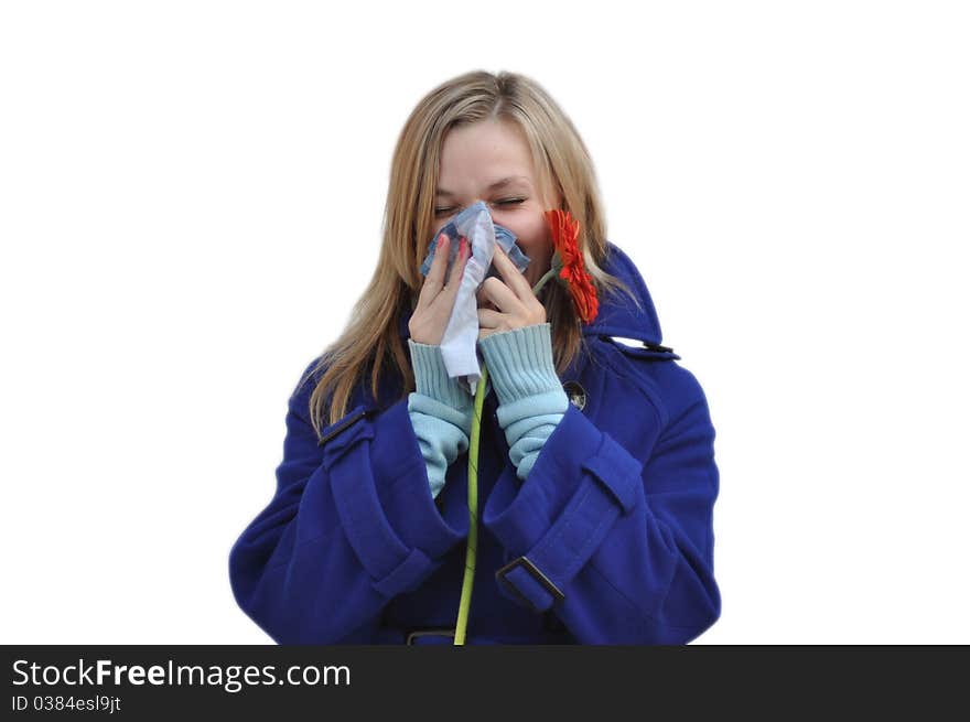 Isolate the image of a woman with a runny nose in a blue coat over a white background