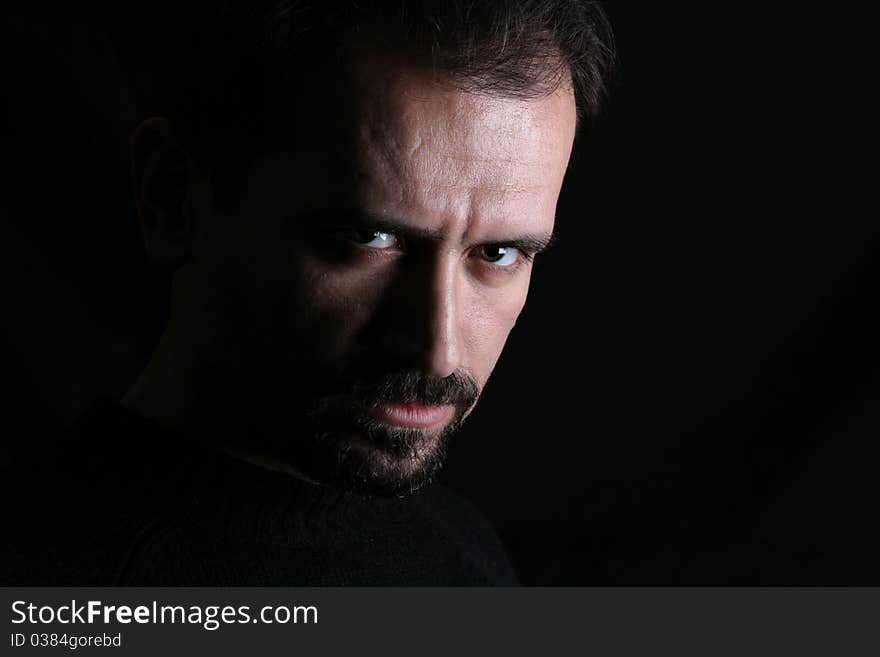 Portrait of a handsome young man on black background. Portrait of a handsome young man on black background