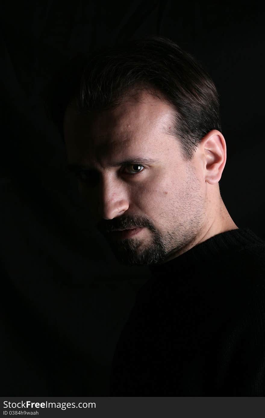 Portrait of a handsome young man on black background. Portrait of a handsome young man on black background