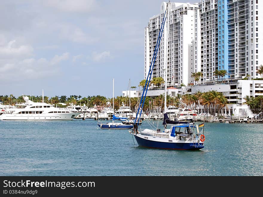 Sailboat at anchor at a condo marina in the southbeach section of Miami Beach. Sailboat at anchor at a condo marina in the southbeach section of Miami Beach