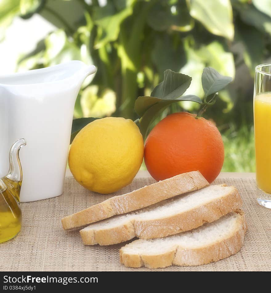 Tipical mediterranean breakfast with fruits, juice, bread and olive oil. Tipical mediterranean breakfast with fruits, juice, bread and olive oil