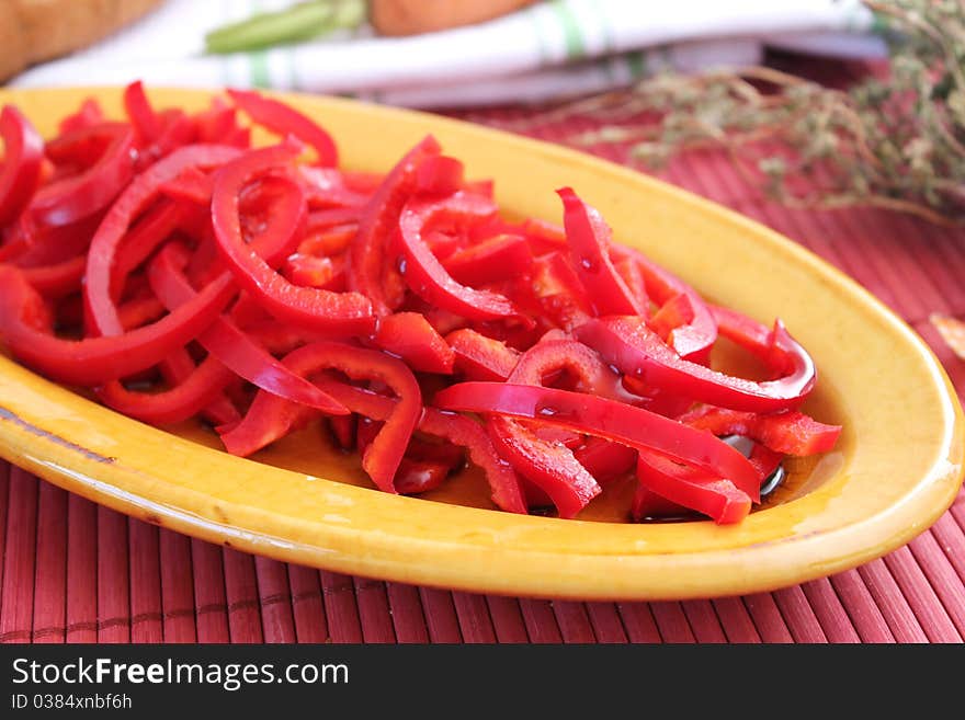 Salad of red bell pepper on a plate