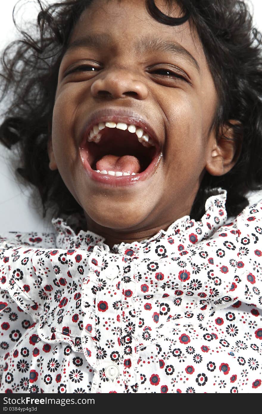 Portrait of little Indian girl on a white background