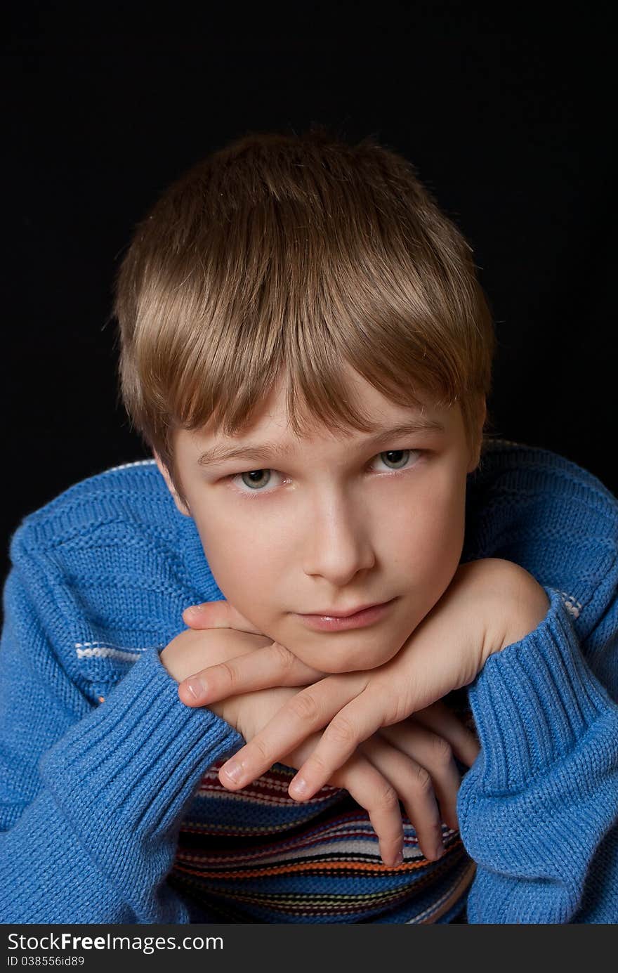 Portrait of a teenager on a black background