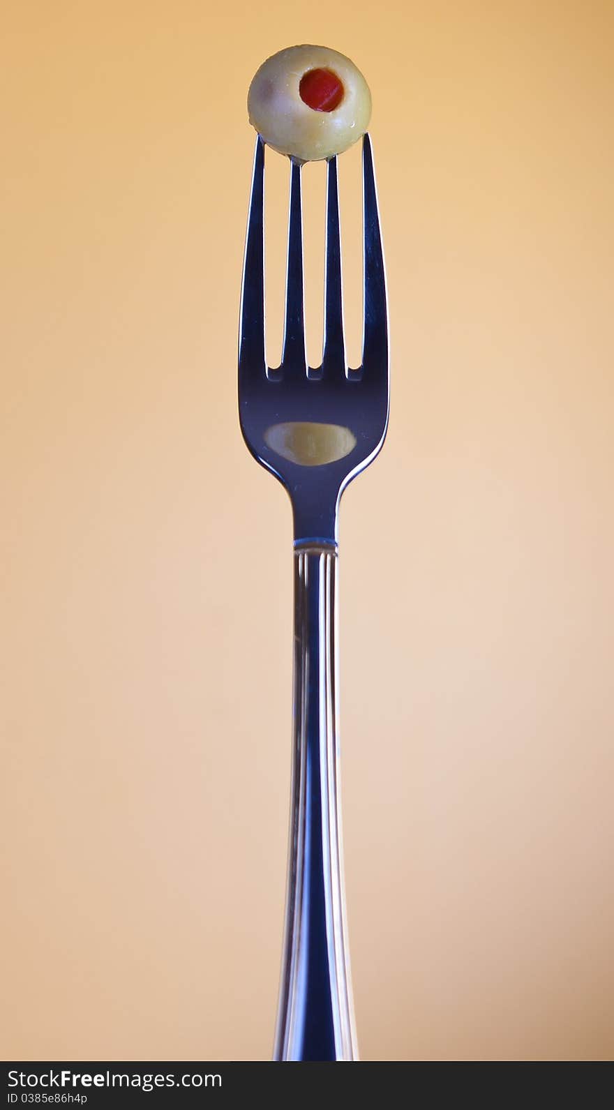 Olive on fork