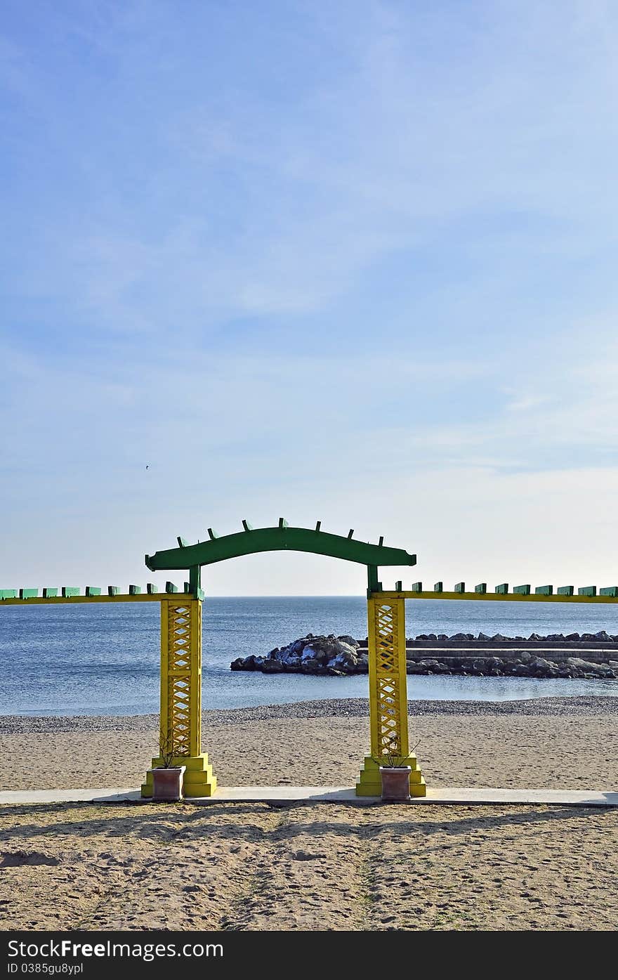 Old wooden sea gate on the beach