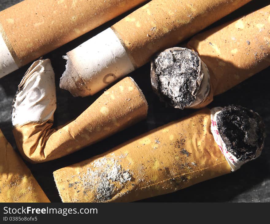 Smoked cigarette-end with ash. Smoked cigarette-end with ash