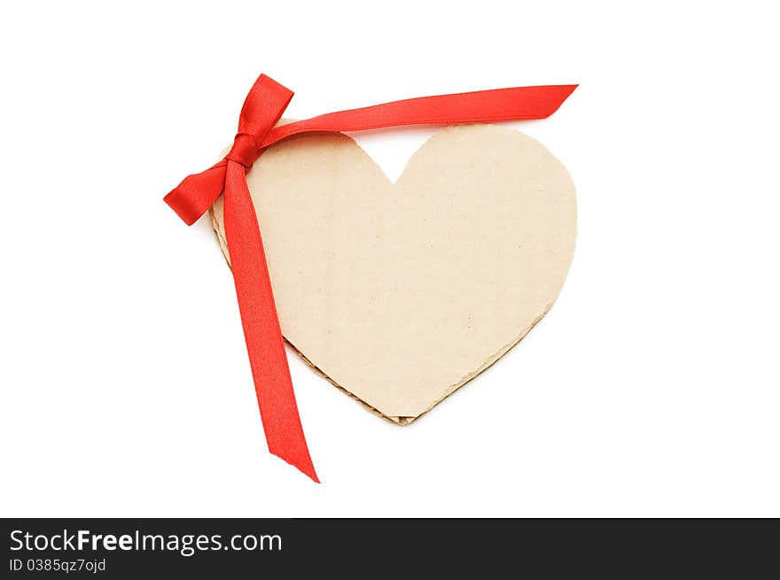 Heart from a cardboard with a bow