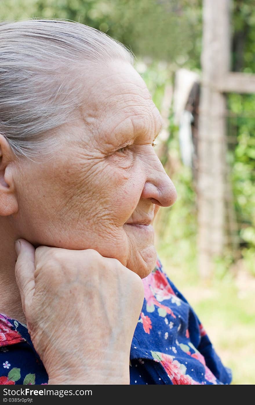 Portrait of the old woman outdoor