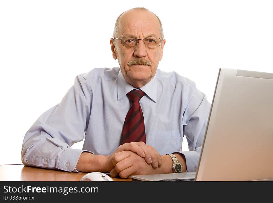 Businessman at the computer isolated on white background