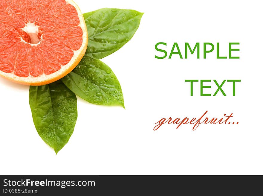 Fresh juicy grapefruits with green leafs