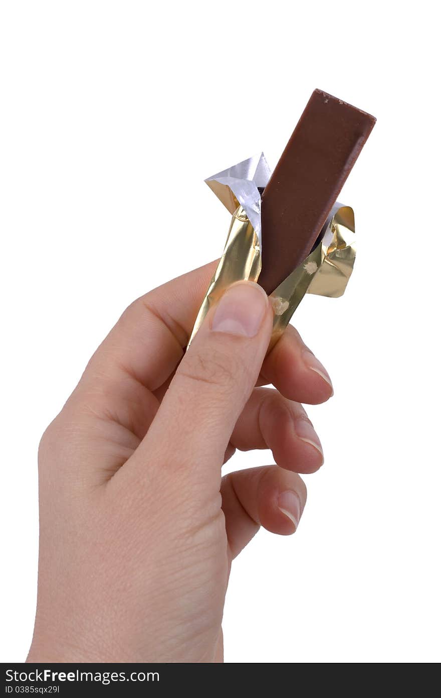 Hand holding chocolate isolated on white