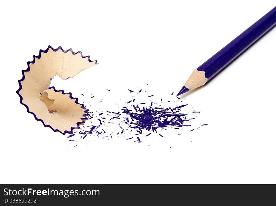 The undermined dark blue pencil and shaving isolated on a white background