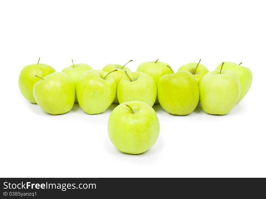 Green and yellow apples on a white baclground