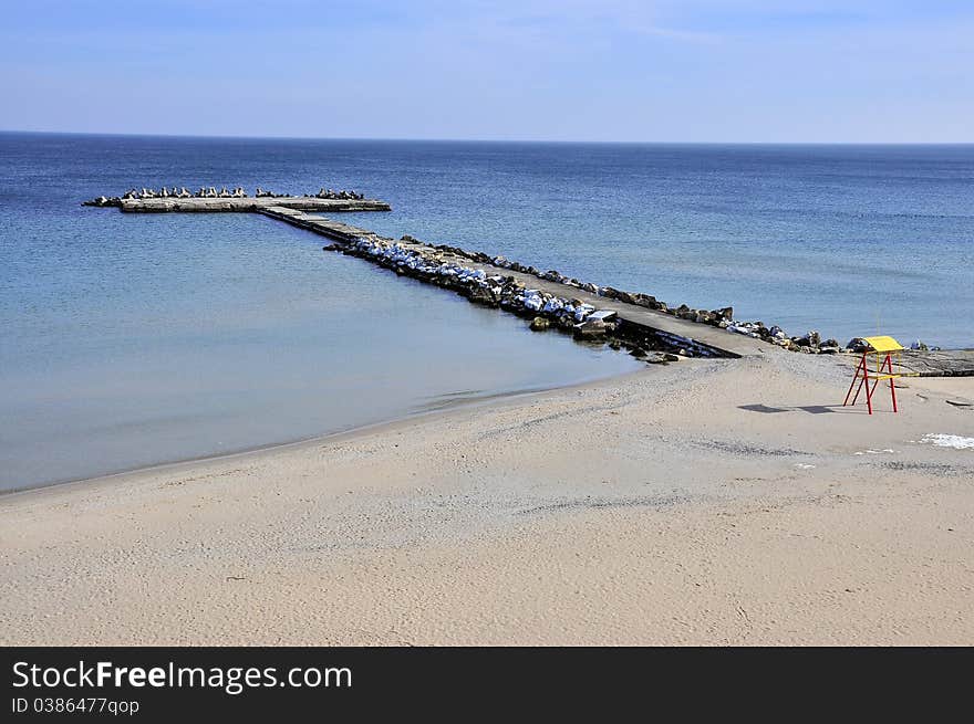 Lonely on the beach and dam