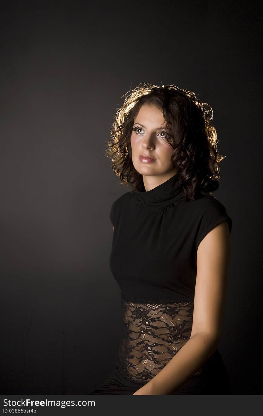 Portrait of the girl of model, focusing on eyes, on a black background