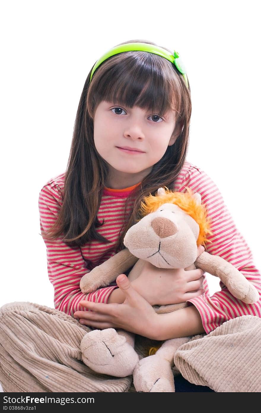 Portrait of beautiful young girl hugging toy tiger. Portrait of beautiful young girl hugging toy tiger