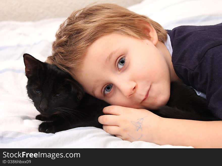 Littel boy with a cat