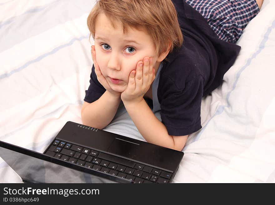 Sweet little boy on laptop