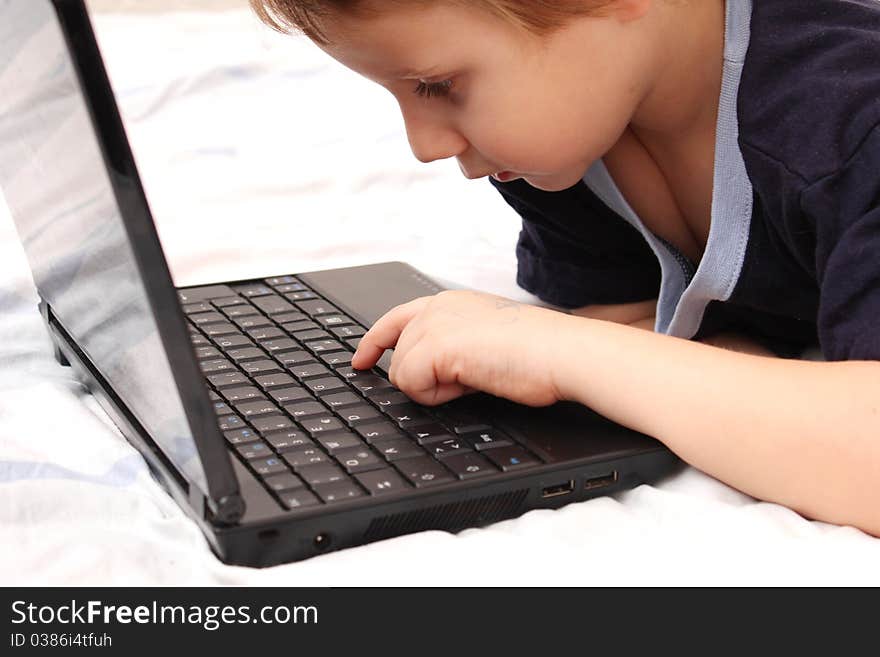 Sweet little boy on laptop