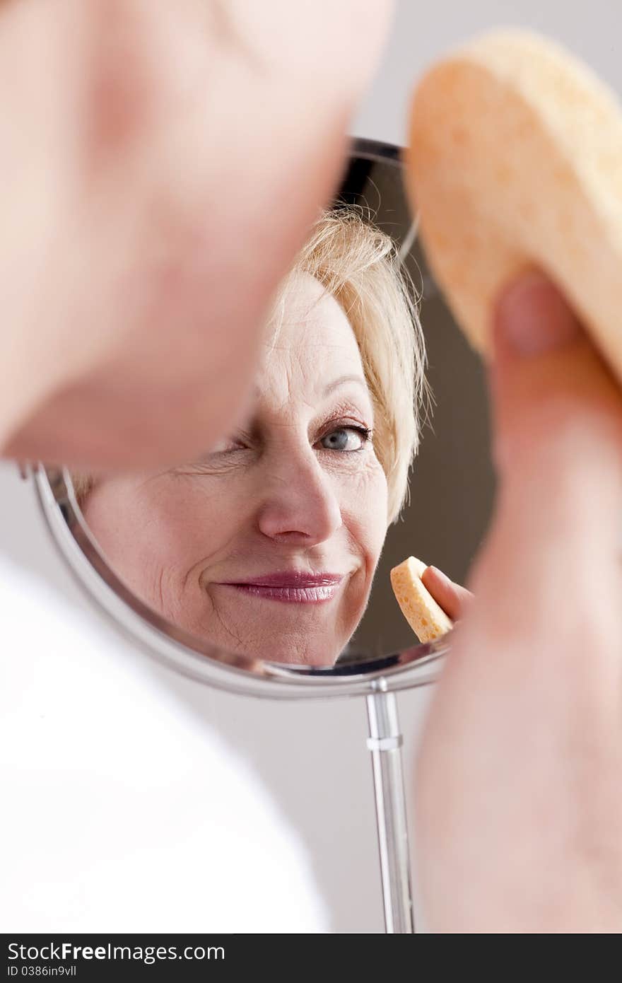 Mature beautiful Woman Cleaning Face. Mature beautiful Woman Cleaning Face