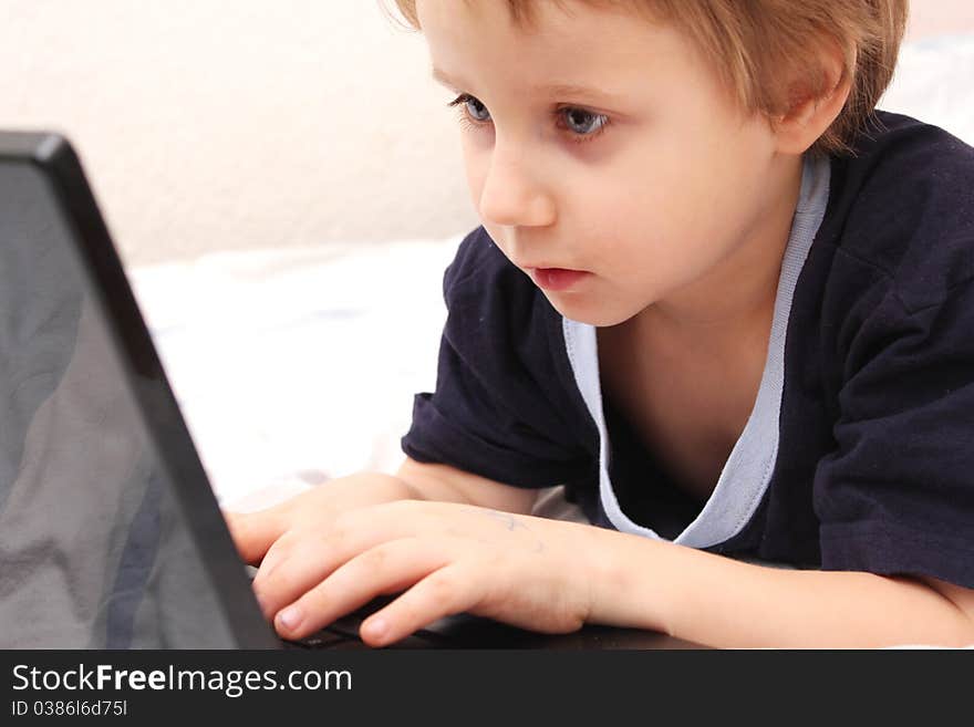 Sweet little boy on laptop