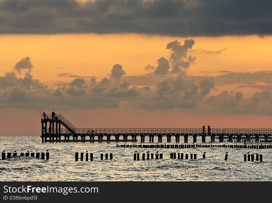 Pier in Ustronie Morskie, Poland just after sunrise. Pier in Ustronie Morskie, Poland just after sunrise.