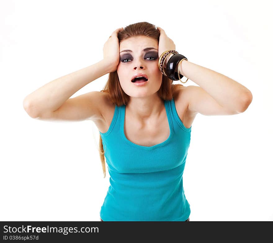 Girl in a dark makeup in blue T-shirt on white background with expression