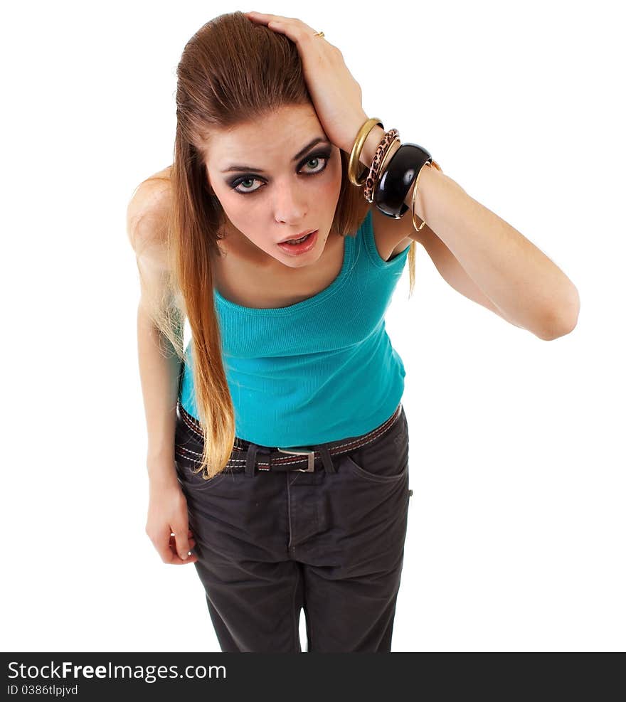 Girl in a dark makeup in blue T-shirt on white background with expression. Girl in a dark makeup in blue T-shirt on white background with expression