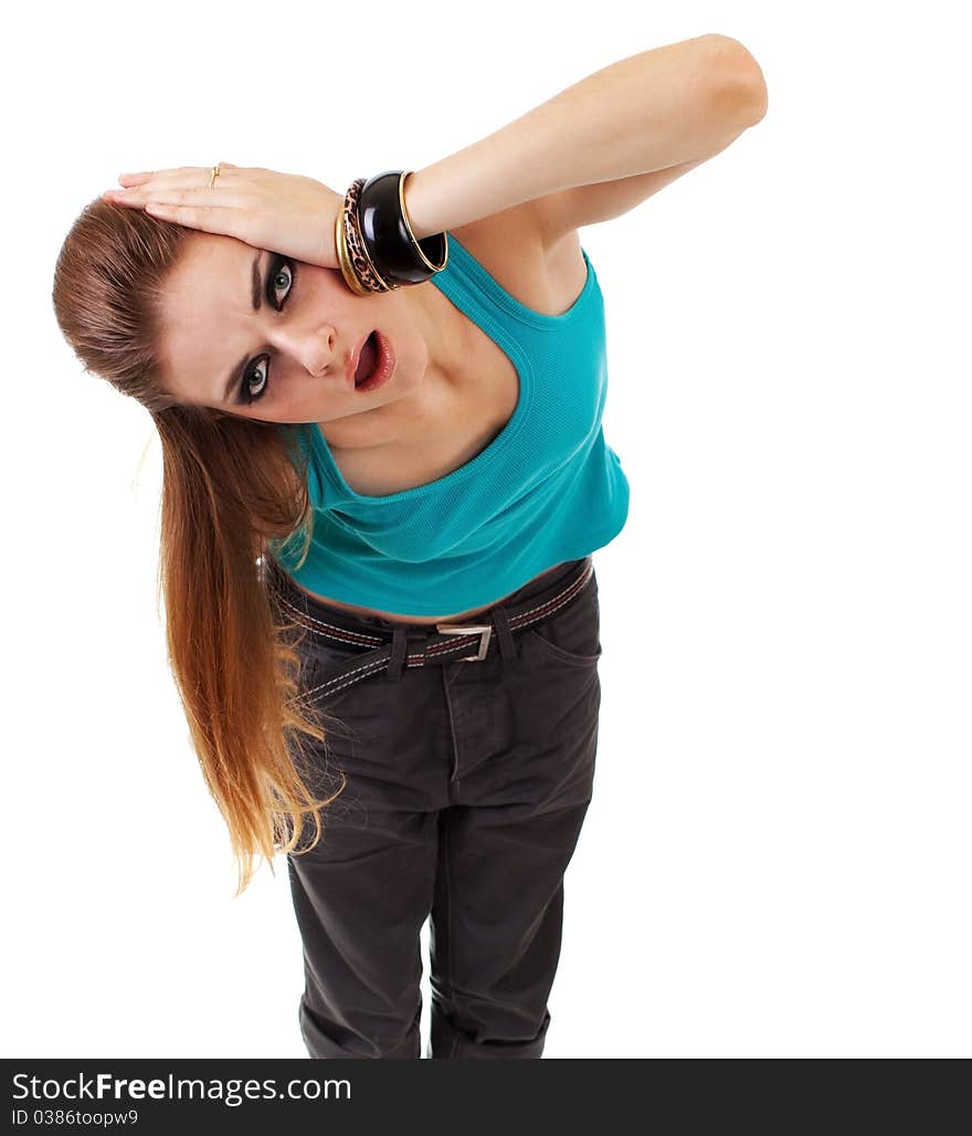 Girl in a dark makeup in blue T-shirt on white background with expression. Girl in a dark makeup in blue T-shirt on white background with expression